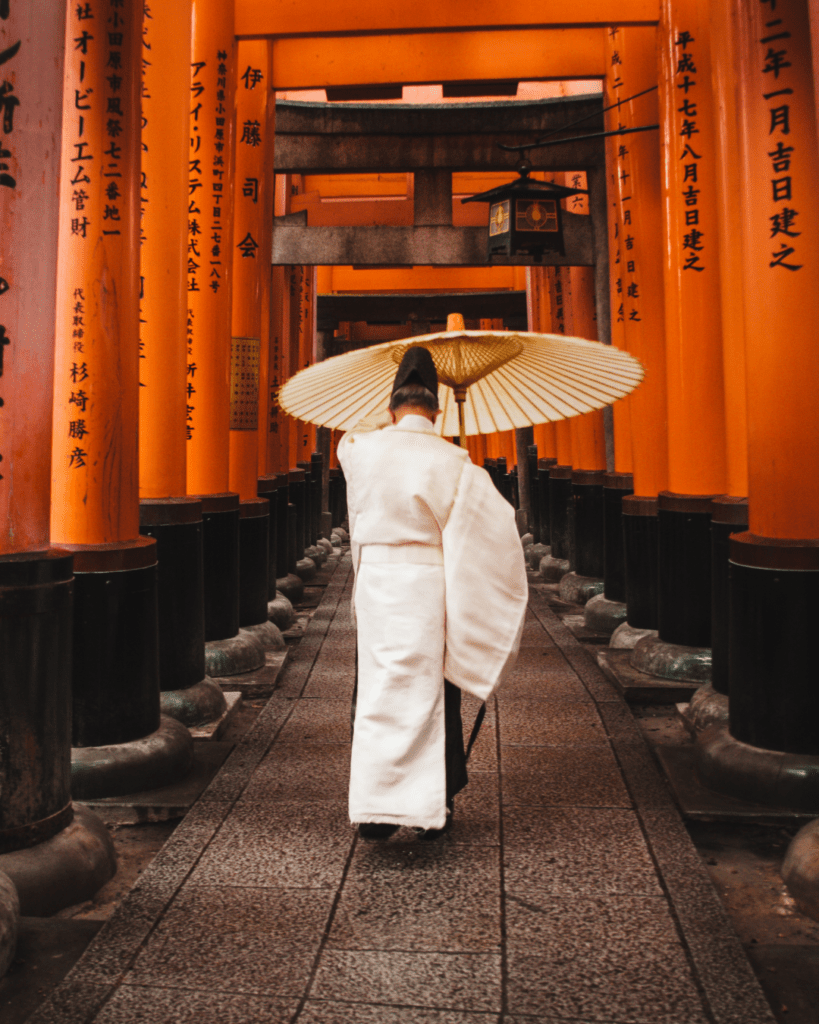 Japanese man with umbrella | Panache World Luxury Travel | Contact Us
