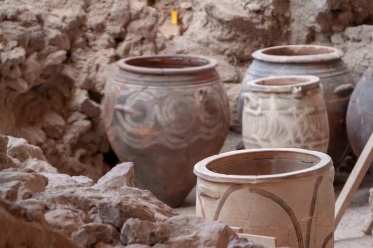 Massive pithos jars containing remnants of olive oil and preserved fish suggest a community engaged in substantial trade networks