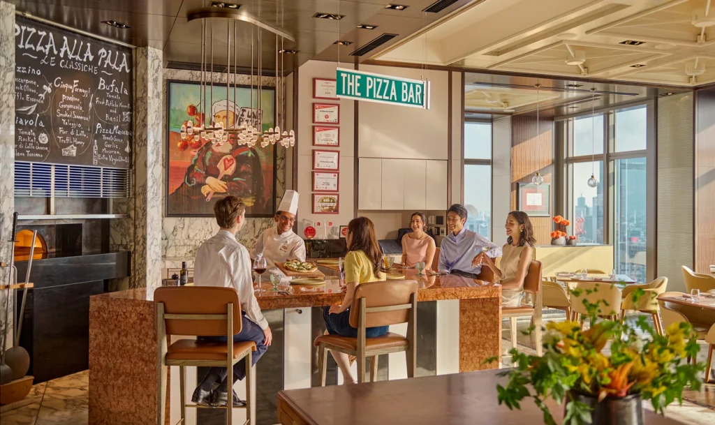 The pizza bar accepts up to eight guests at a time. Chefs guide the guests course-by-course
through a thoughtful selection of pizzas.